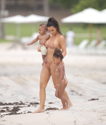 Kim Kardashian enjoyed her summer vacation with baby Saint and North West as they all play in the sand together at Casa Aramara in Punta Mita Mexico  North was joined by her baby brother for his first tropical trip in the water together as a family. Kim was having fun on the ground with the baby as she and her daughter spent some quality time together all in their summer swimwear.Mandetory mention of "Casa Aramara in Punta Mita Mexico"Ref: SPL1336080  180816  Picture by: Splash NewsSplash News and PicturesLos Angeles:310-821-2666New York:212-619-2666London:870-934-2666photodesk@splashnews.com