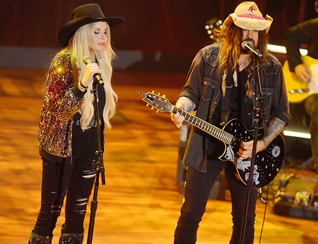 Firerose and Billy Ray Cyrus performing on stage