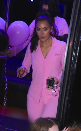 Kim Kardashian wears custom pink sleepwear outfit as she matches her daughter North and sister Kourtney as they celebrate on a party bus for her 10th birthday in Los Angeles. Kim was all smiles as she held onto multiple cell phones as they ended their night back at the Beverly Hills Hotel where they were treated to a villa for North and all of her friends. 14 Jun 2023 Pictured: North West, Kim Kardashian, Kourtney Kardashian. Photo credit: MEGA TheMegaAgency.com +1 888 505 6342 (Mega Agency TagID: MEGA995513_001.jpg) [Photo via Mega Agency]