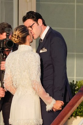 Blushing bride Sofia Richie looks radiant in an elegant white gown as she celebrates her lavish wedding weekend in the French Riviera. The model and daughter of legendary crooner Lionel Richie stepped out with her British fiance Elliot Grainge on Friday evening during their ultra glamorous trip to tie the knot in Antibes. It was unclear whether the happy couple were heading off to a fancy rehearsal dinner, or were dressed up for the nuptials. The stylish 24-year-old chose a demure, delicately beaded floor length ensemble for the occasion paired with white stilettos and wore her long hair in a chic up do. Her record executive groom, 30, looked dapper in a dark suit and tie as they were snapped by their team of photographers at their swanky hotel at sunset. Among the slew of A-list guests jetting in to watch them exchange vows are Cameron Diaz and Benji Madden, Sofia’s sister Nicole Richie and husband Joel Madden, as well as her father Lionel Richie and brother Miles. 21 Apr 2023 Pictured: Sofia Richie , Elliot Grainge. Photo credit: EliotPress / MEGA TheMegaAgency.com +1 888 505 6342 (Mega Agency TagID: MEGA971732_018.jpg) [Photo via Mega Agency]