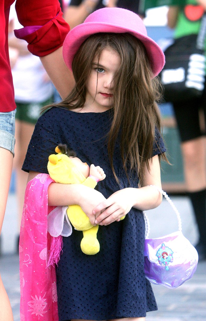 Suri Cruise Carries A Doll