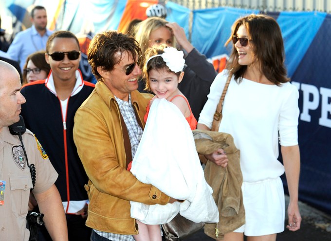 Tom Cruise Carries Suri At Super Bowl XLIV